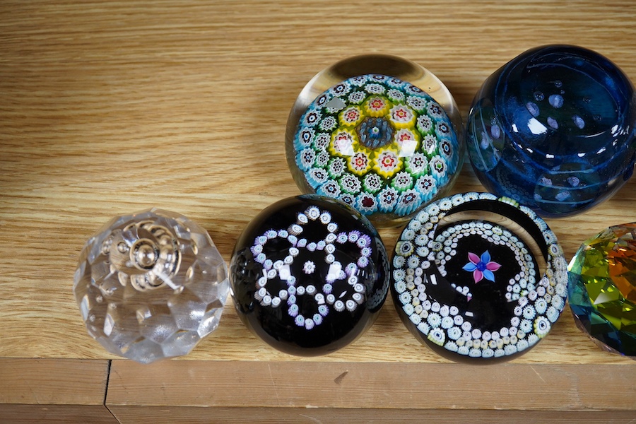 A group of paperweights to include Waterford, Caithness and Edinburgh, largest 8cm in diameter. Condition - fair to good